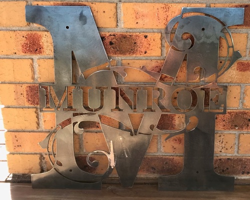 metal family name sign